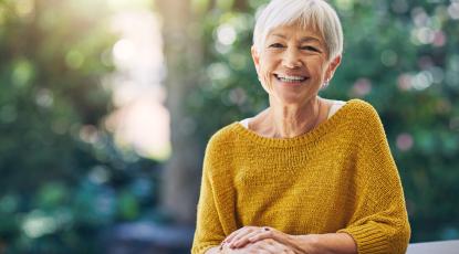 older woman smiling outdoors